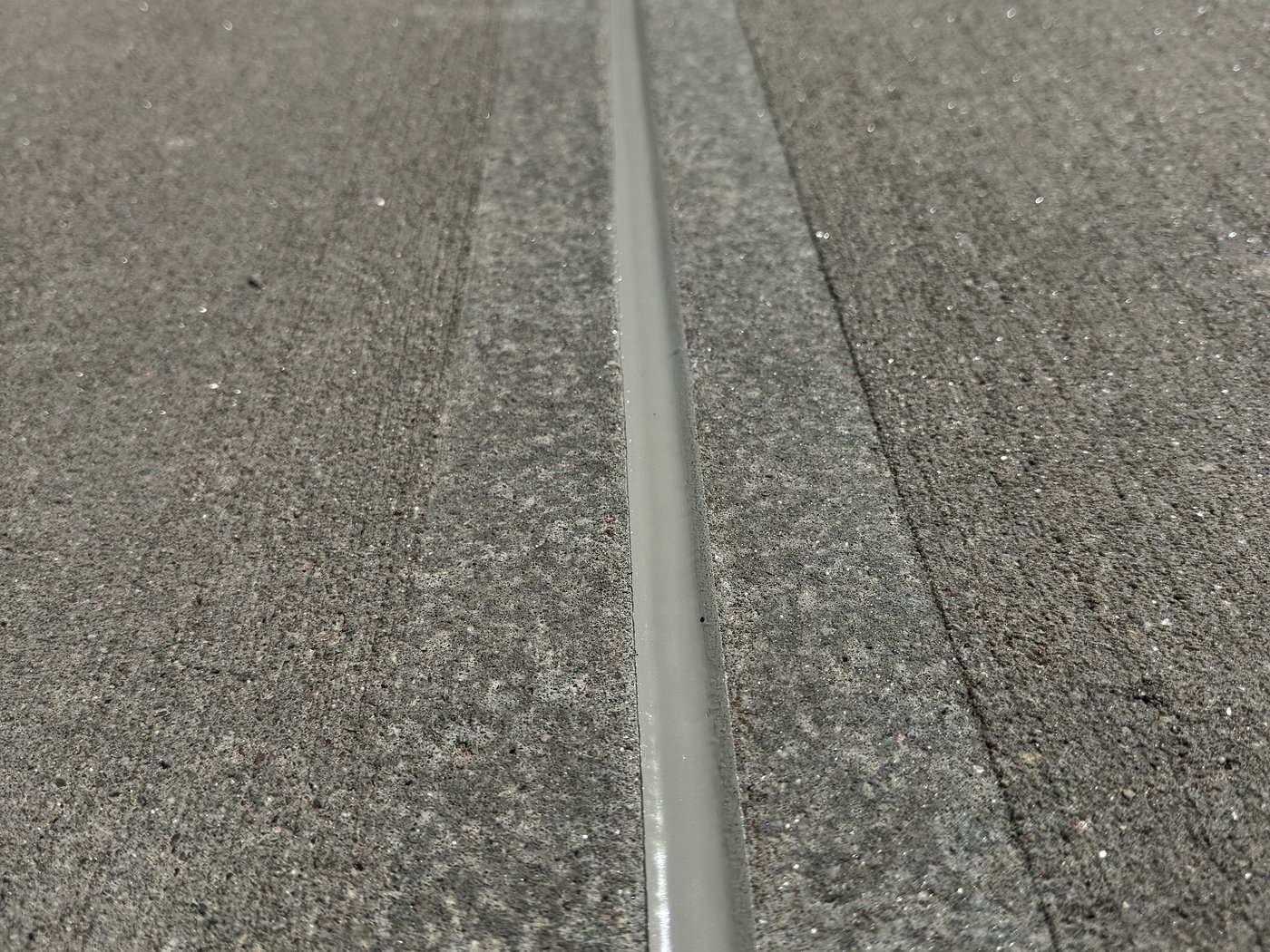 Fresh concrete caulking on expansion joint